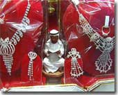 Kitch wee statues with Koran